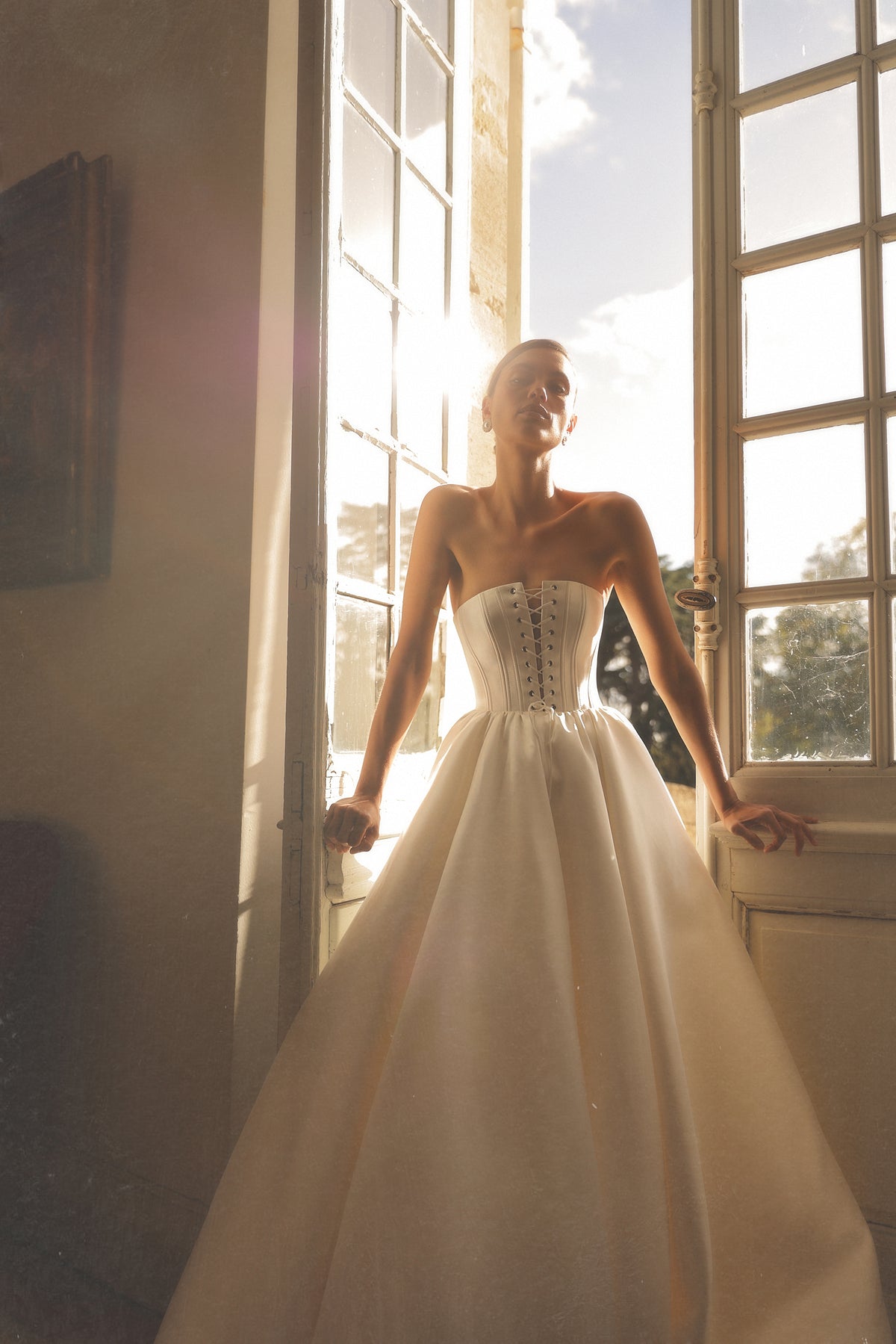 Modena by Maison Harleen couture gown — three-quarter view highlighting the bodice details
