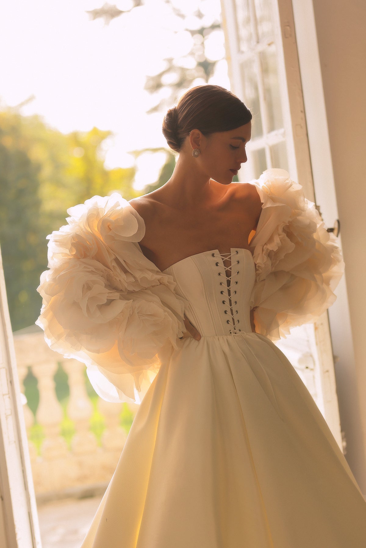 Modena by Maison Harleen couture gown — side profile displaying the fabric drape