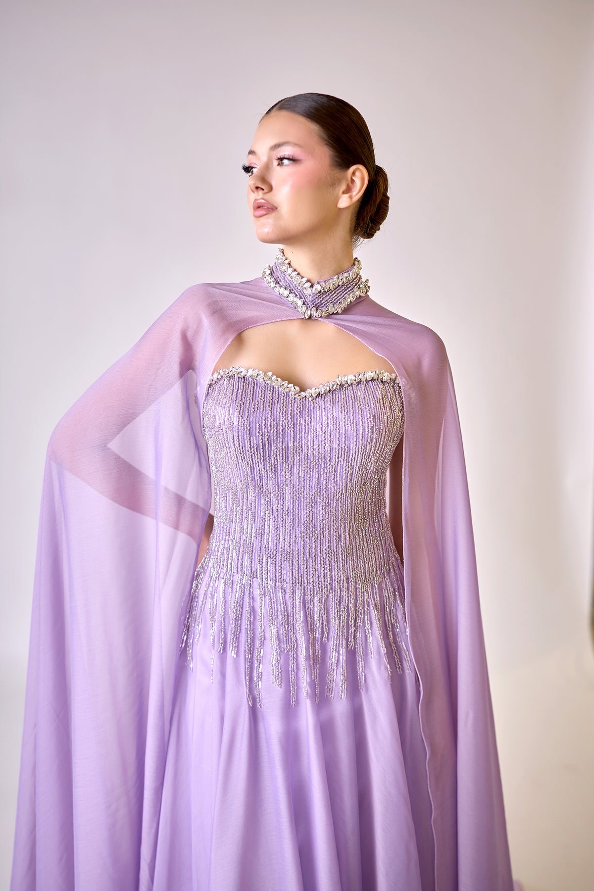 Lysandra Lavender Crystal Fringe Cape Couture Evening Gown — three-quarter view highlighting the bodice details