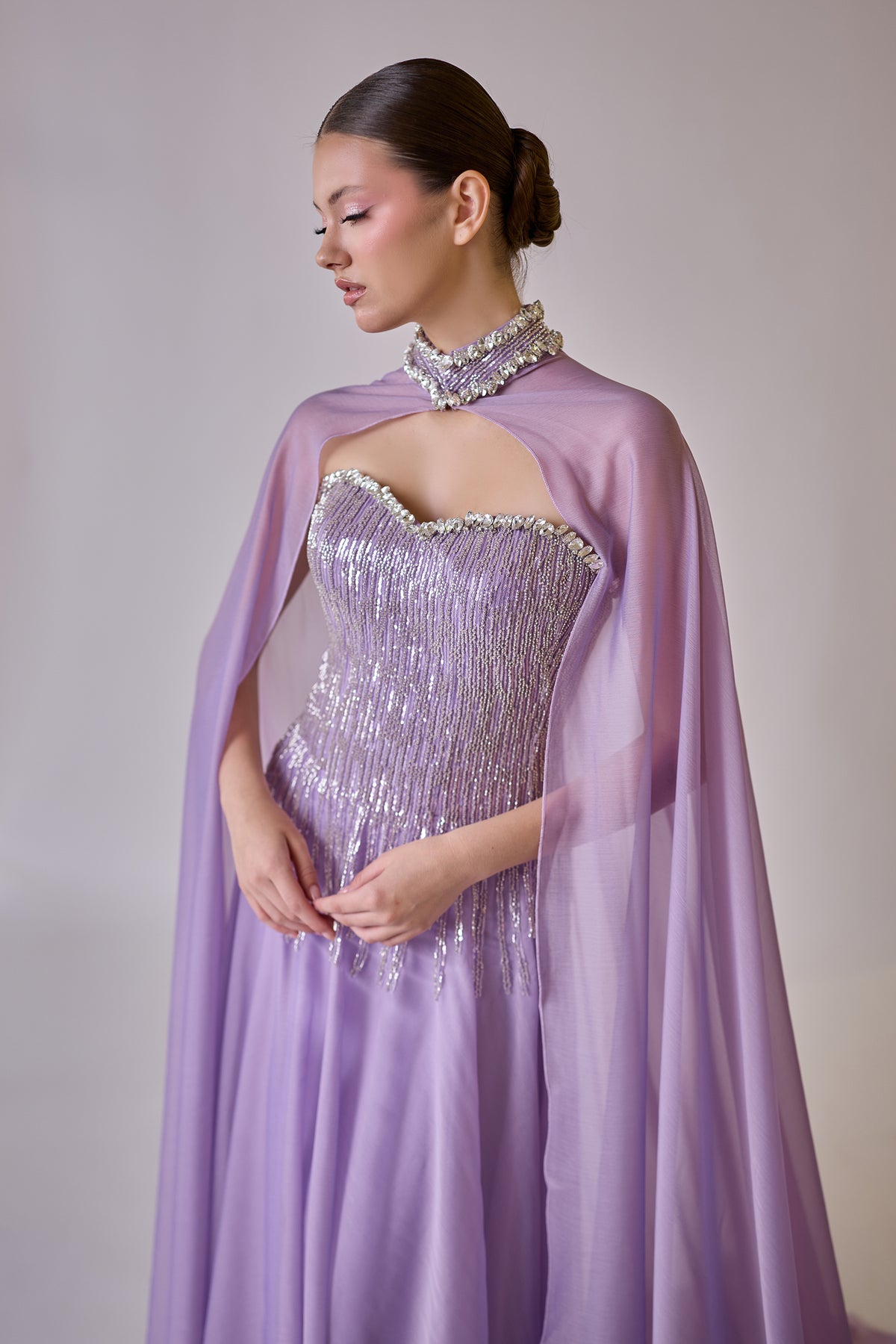 Lysandra Lavender Crystal Fringe Cape Couture Evening Gown — side profile displaying the fabric drape