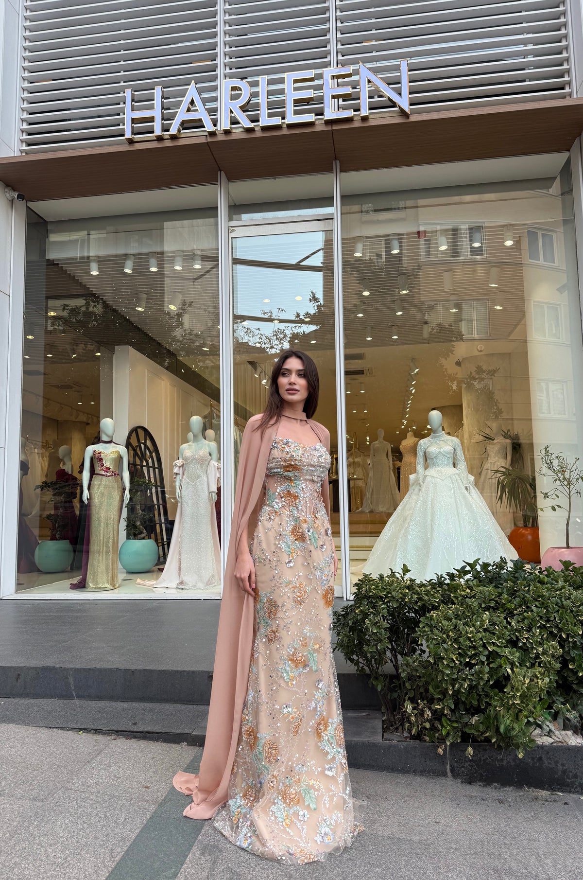 Model wearing Aurielle nude floral couture gown with elegant feminine silhouette