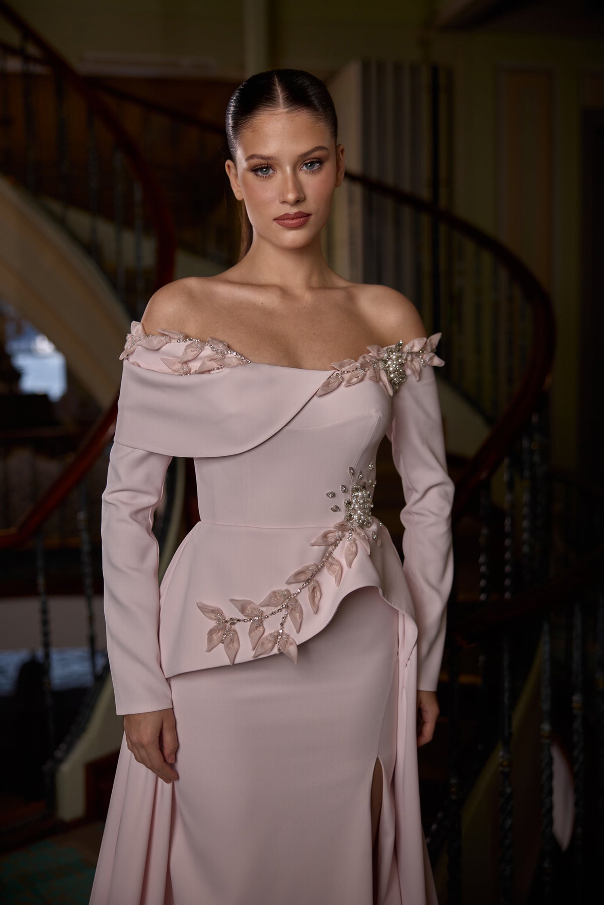 Model wearing Dixie off-shoulder modest evening gown with floral embellishments and elegant silhouette
