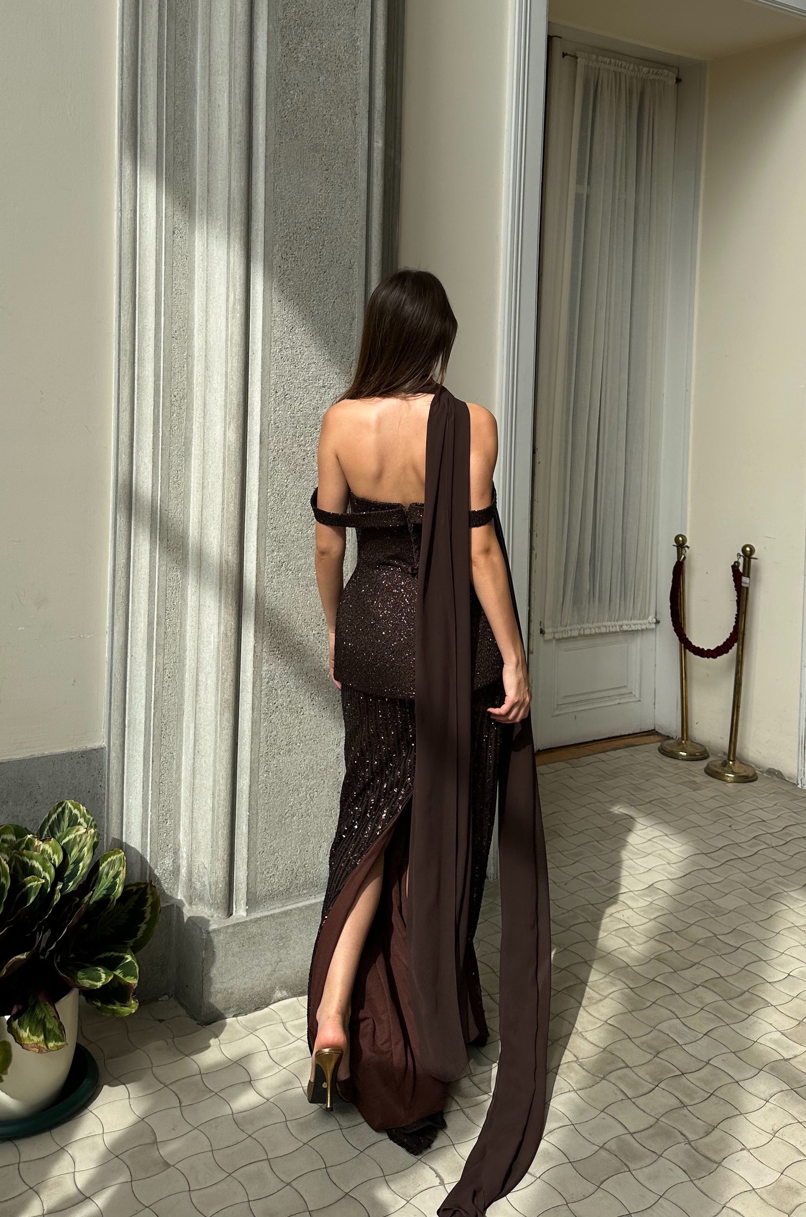 Sophisticated formal gown with fitted silhouette and sparkling sequin texture