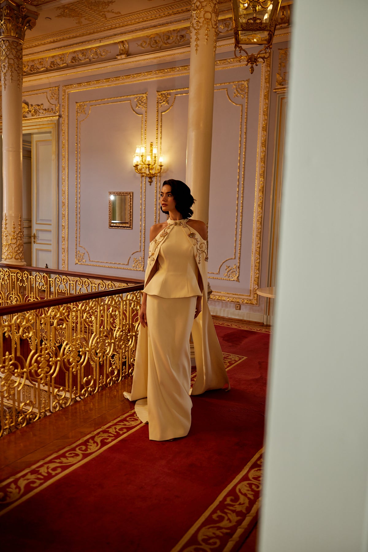 Luxury modest evening dress with high neckline and flowing cape silhouette