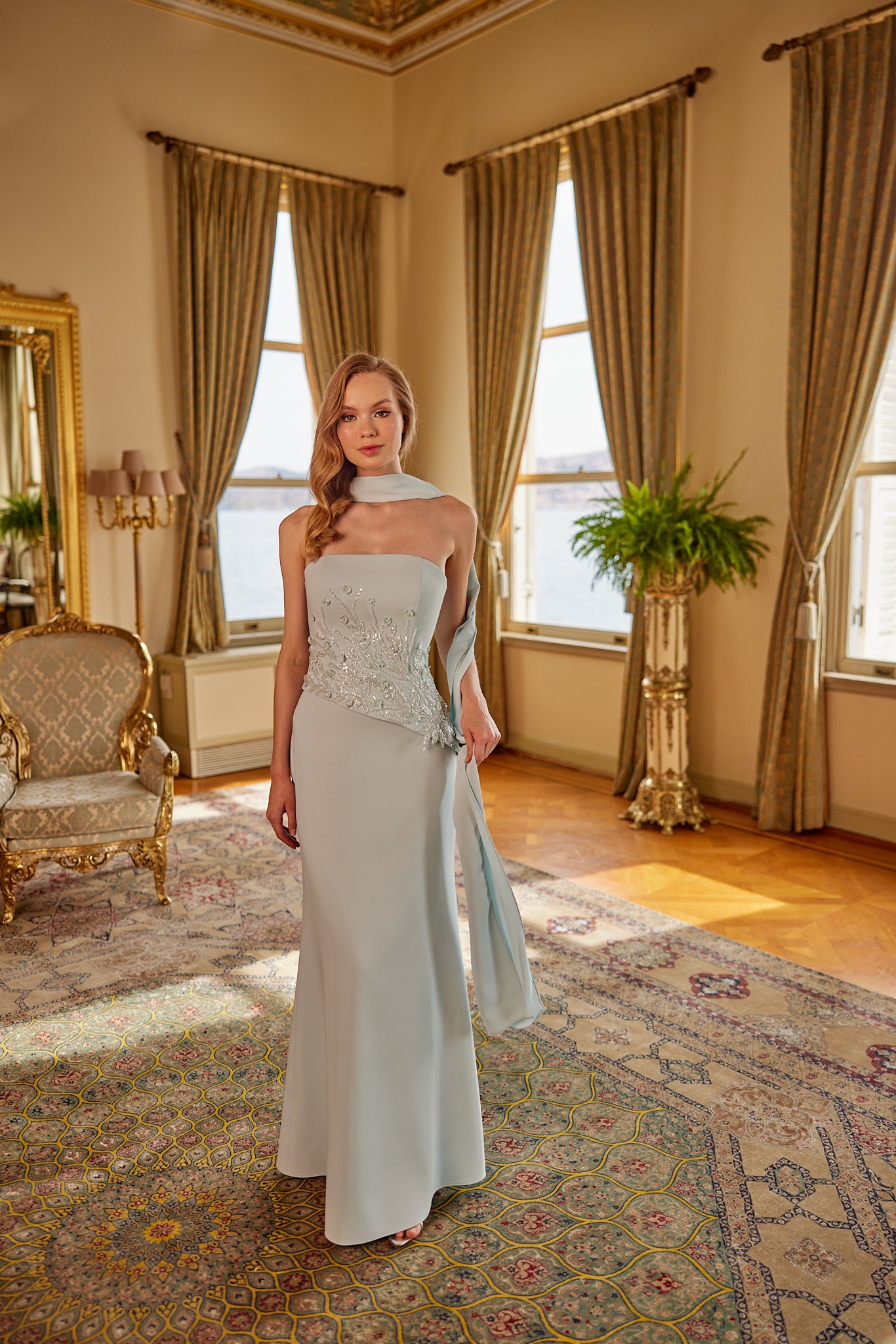 Sophisticated formal gown with flowing silhouette and modern feminine styling