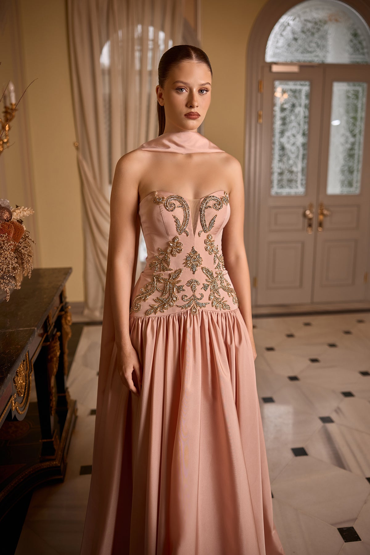 Sophisticated strapless maxi dress with elegant scarf neckline for weddings and formal occasions