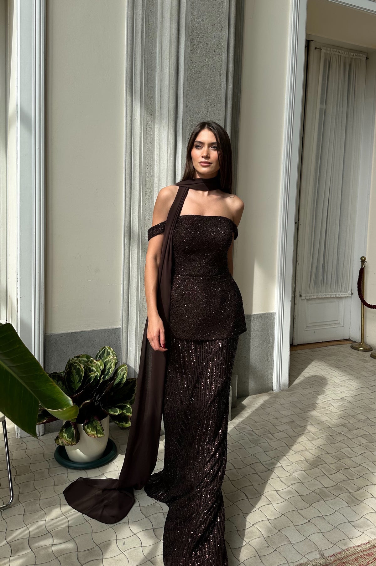Elegant sequin evening gown in deep chocolate with glamorous off-shoulder styling