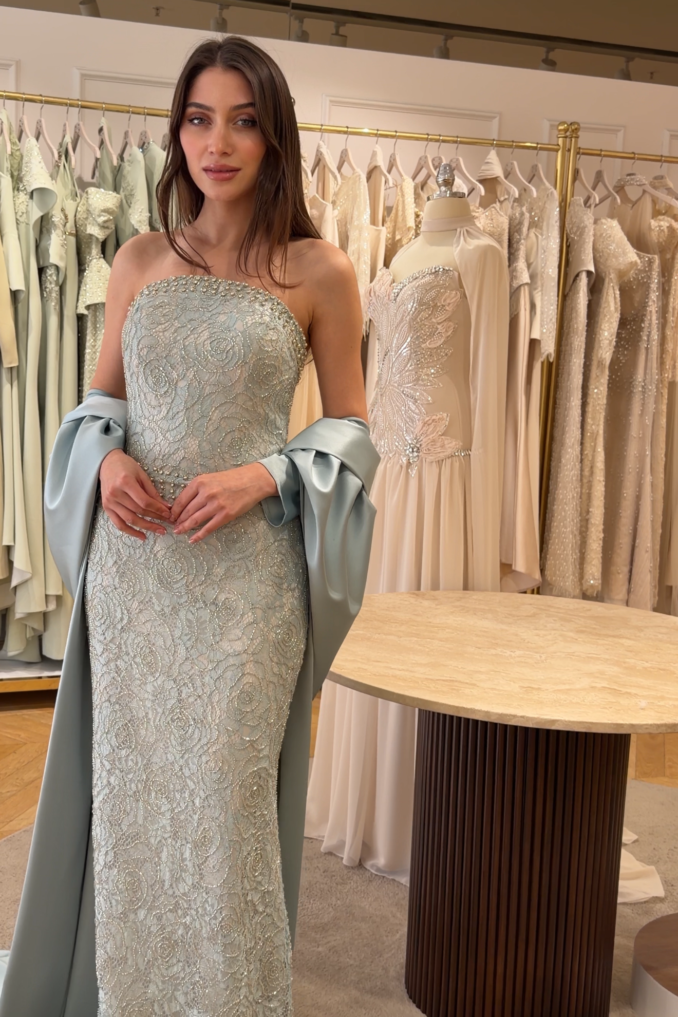 Model wearing Thea Sage lace couture gown with elegant feminine silhouette