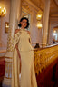 Arabic style couture evening gown with intricate embellishments and elegant structure