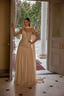 Model wearing Avery embellished strapless modest evening gown with elegant scarf detail