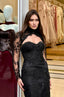 Model wearing Drew embellished sheer sleeve couture evening gown with elegant silhouette