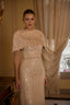 Luxury gold evening dress featuring sparkling sequins and elegant couture styling