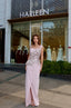 Luxury couture evening dress featuring peplum detail and refined embellishments