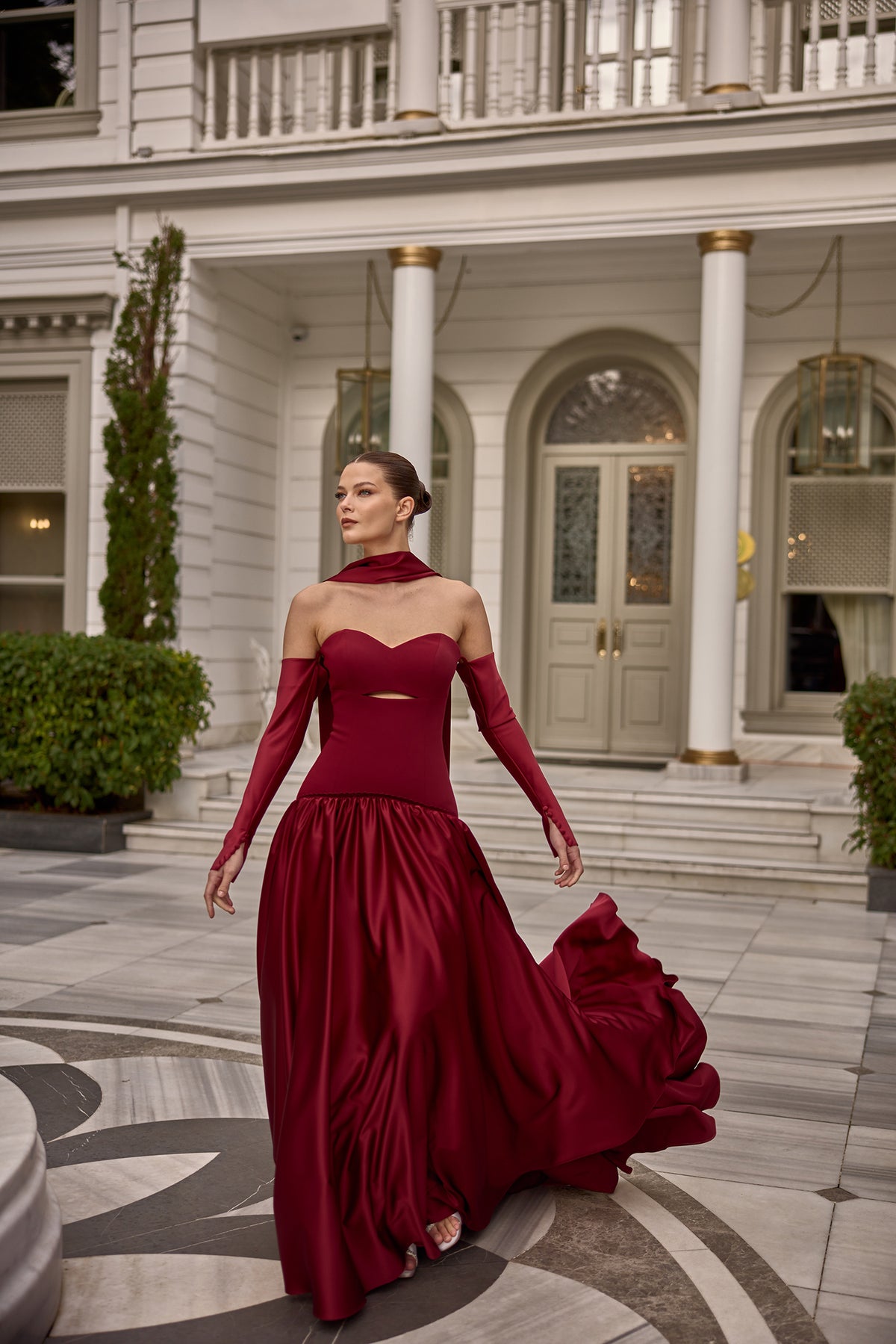 Luxury strapless satin gown featuring scarf neckline detail and fitted bodice