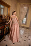 Model wearing Fern embroidered strapless evening gown with soft scarf detail and elegant silhouette