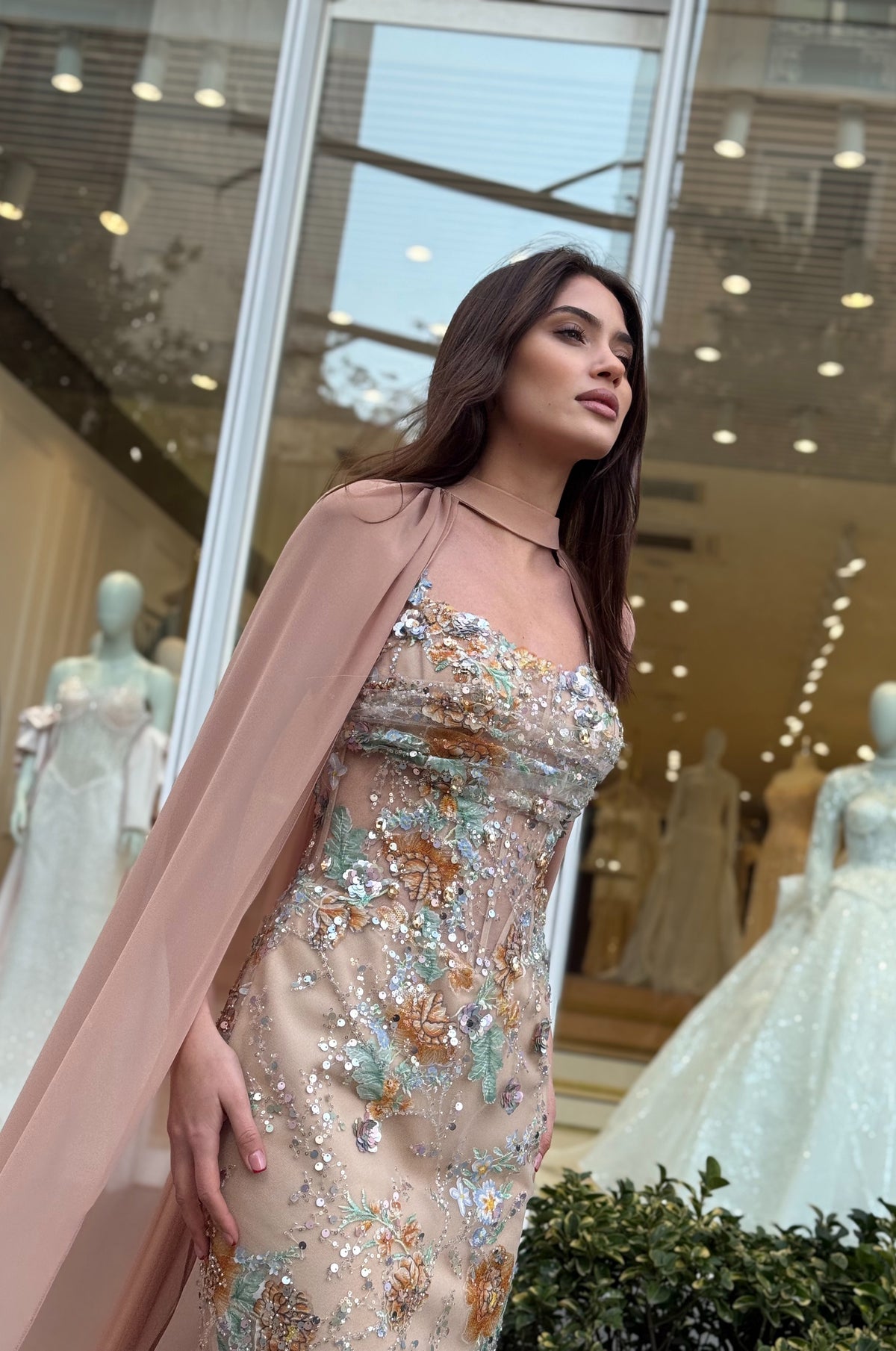Sophisticated formal gown with romantic floral details and flowing maxi design