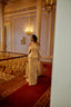 Luxury modest evening dress with high neckline and flowing cape silhouette
