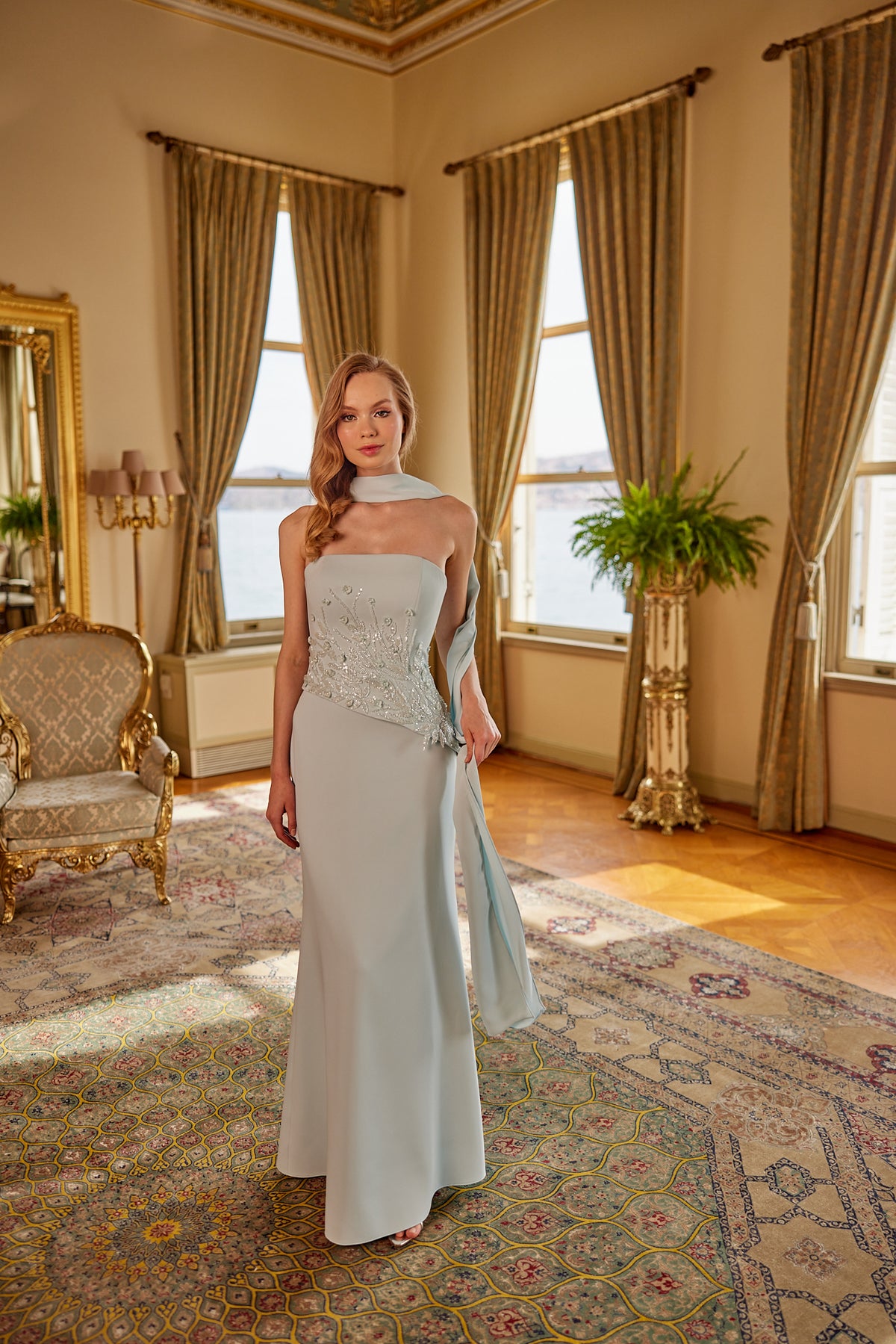 Sophisticated formal gown with flowing silhouette and modern feminine styling