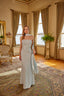 Sophisticated formal gown with flowing silhouette and modern feminine styling