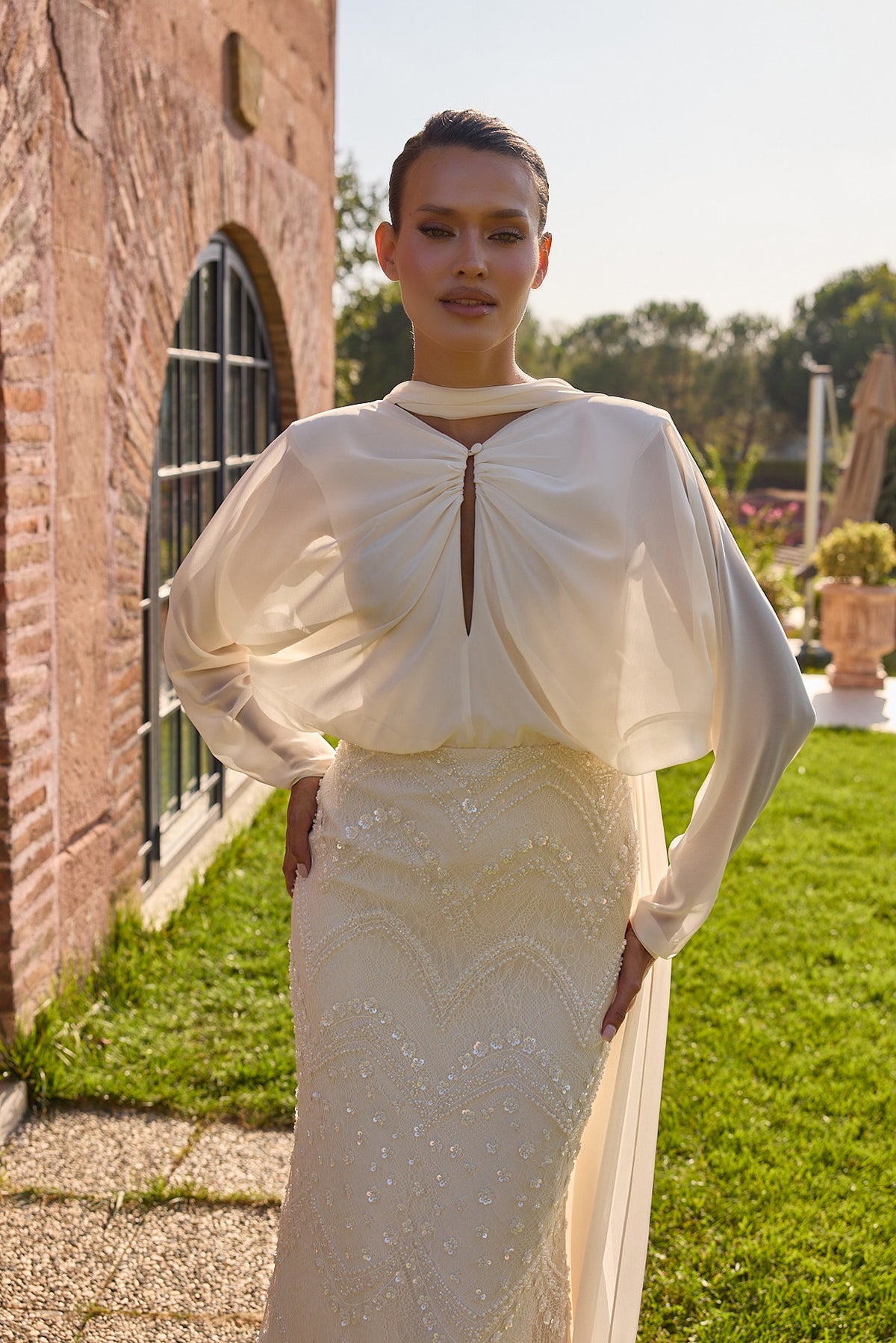 Serenelle Ivory Draped Cape Embellished Gown